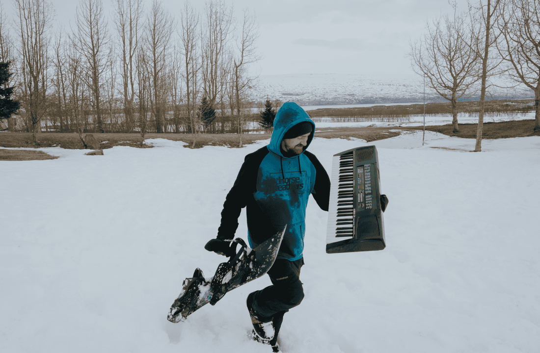 Professional snowboarder Eiki Helgason with 2025 YES snowboard.